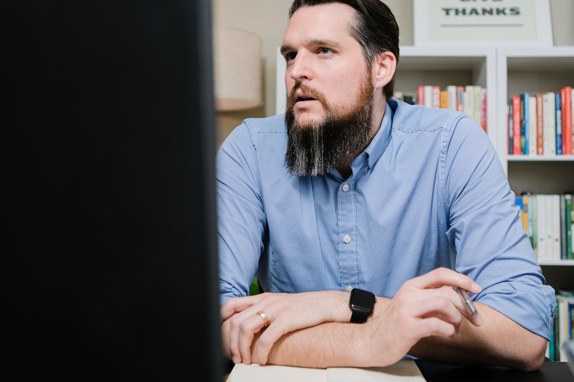 Photo of Erik Reagan at his computer during a coaching session